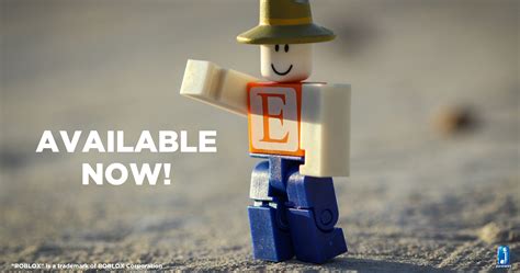 there is a small lego man with a hat on it's head standing in the sand