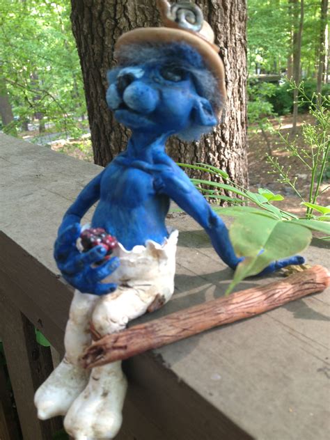 This is a realistic smurf statue I call " Having Lunch with a Friend." He is made out of polymer ...