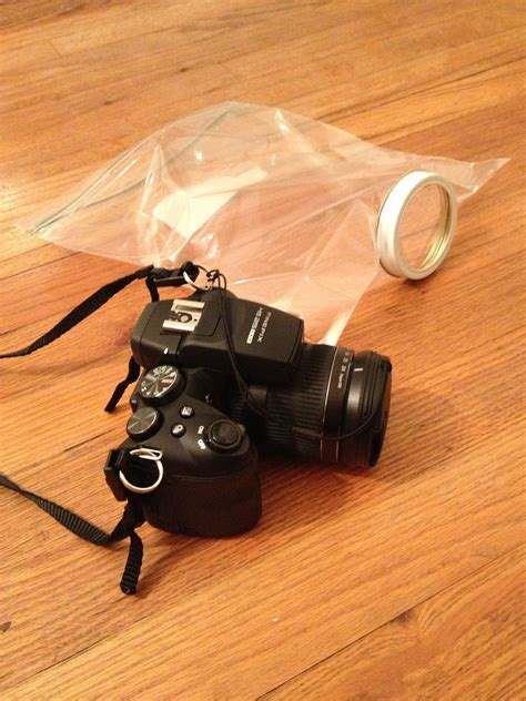 Made my own camera cover for the rain :) all you need is a large zip lock bag and a mason jar top!