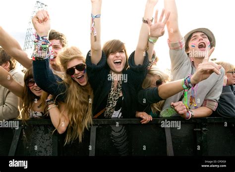 Crowd in front row screaming at a music concert Stock Photo - Alamy