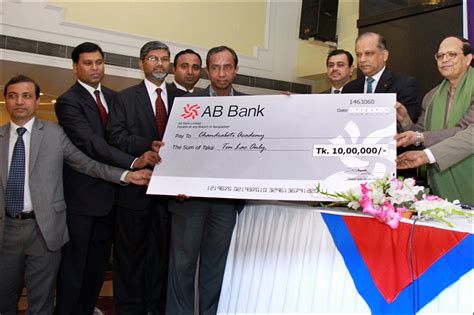 Bangladesh Bank Governor hands over a cheque of loan from AB Bank - AB Bank PLC.