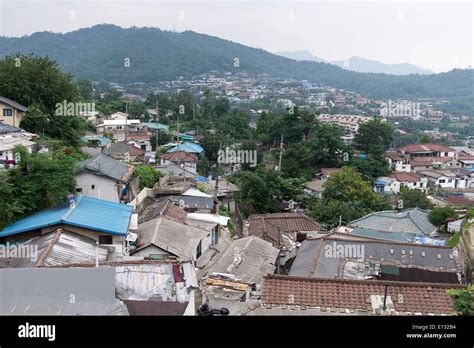 Rural houses in a suburb of Seoul in South Korea with mountains Stock ...