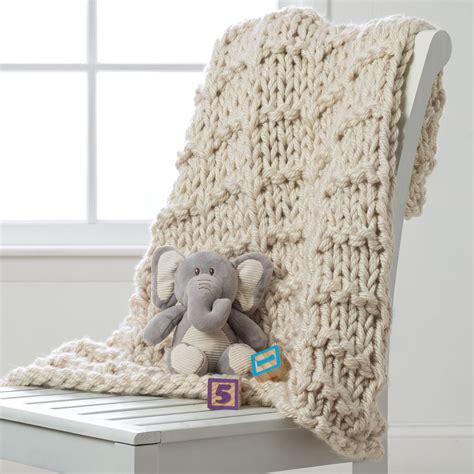 Create this cozy, bulky yarn lap throw with your basic knit and purl ...