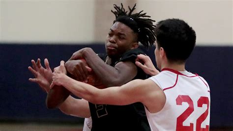 Photos: Xavier boys' basketball win first round playoff game