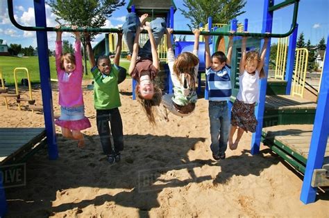 Group Of Children Playing In A Park - Stock Photo - Dissolve