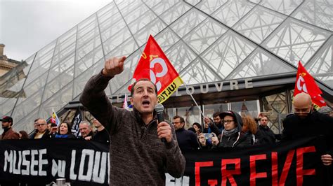 Emmanuel Macron rushed out of Paris theatre after protesters try to ...