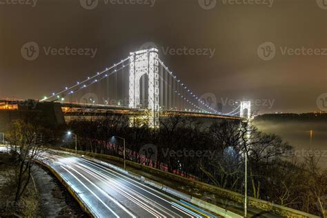 George Washington Bridge fully illuminated at night from New York City ...