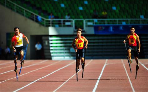 Stilt race, also named high foot race, is a traditional sport at chinese ethnic games with feet ...