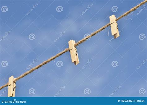 Clothes pegs on line stock photo. Image of background - 112675362