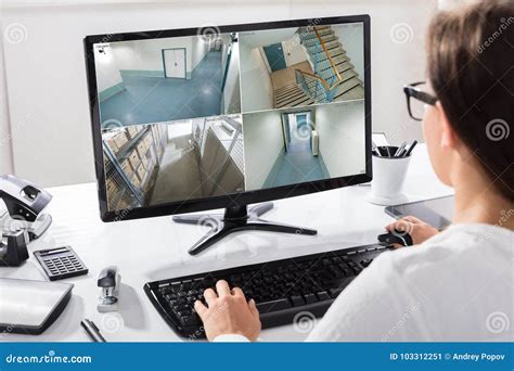 Businesswoman Watching CCTV Footage on Computer Stock Image - Image of monitoring, screen: 103312251