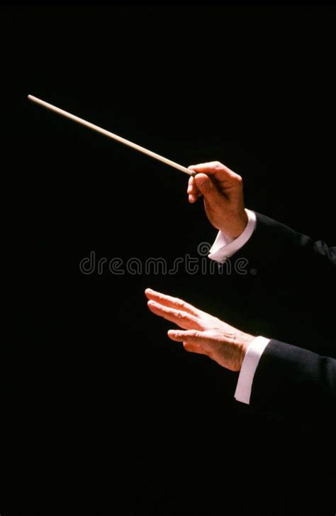 Conductor with baton. Conductor has a baton to give the right ...