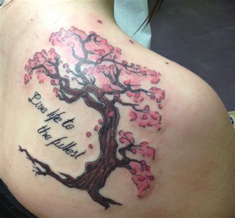 This is my tattoo, it's a cherry blossom tree with the words Live Life To The Fullest. To me the ...