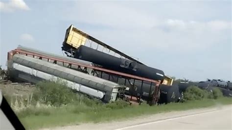 Derailment of train carrying hazardous materials in Minnesota closes highway, but there are no ...