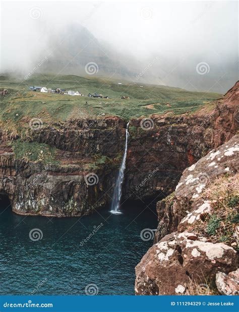 A Storm Blows the Mulafossur Waterfall Stock Image - Image of faroes ...