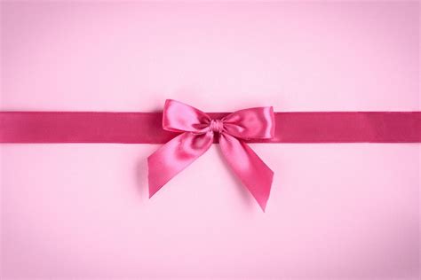 Premium Photo | Pink bow on pink background.