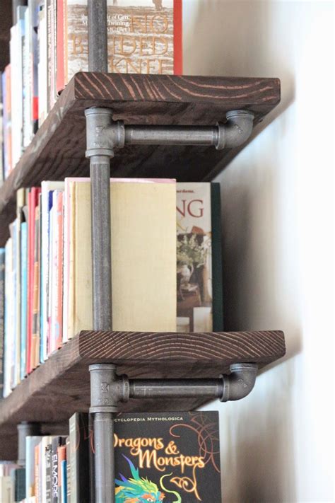 Diy black pipe book shelf - saadarchitect