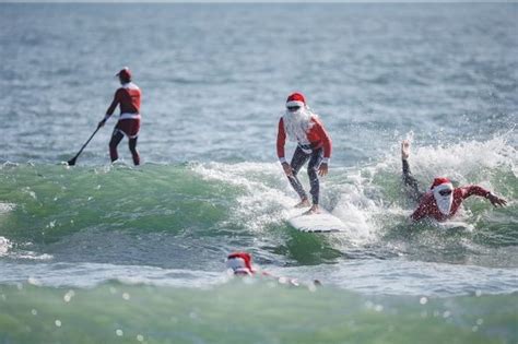 Surfing Santas hit the beach in Florida