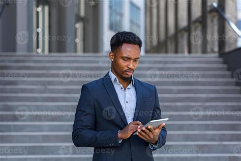 Young african american businessman in formal business suit standing ...