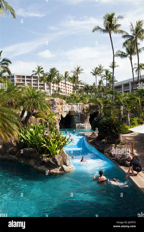 Pool with a river and swimmers at the Grand Wailea; Wailea, Maui ...