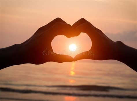 Couple Holding Hands Heart Love At Sunset On Beach Stock Photo - Image of feeling, close: 50607012