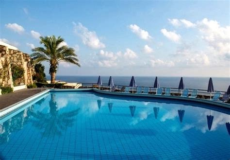 An all-inclusive, five-star beachfront hotel built into the cliffside ...