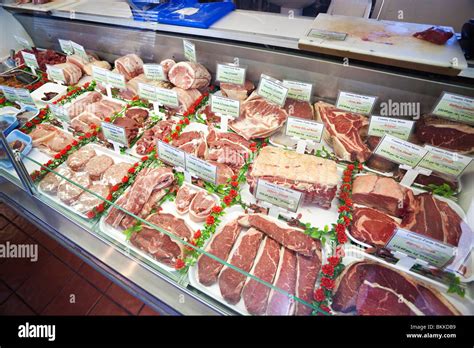 meat display at a butchers shop Stock Photo - Alamy