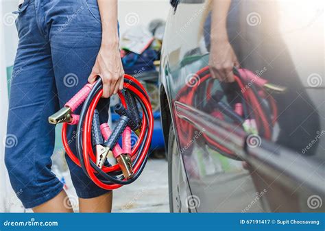 Hand Holding Jumper Cable for Recharge the Battery Stock Image - Image of brass, black: 67191417