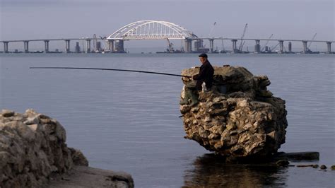 Putin Cements Russian Hold on Crimea with Opening of Bridge - The New York Times