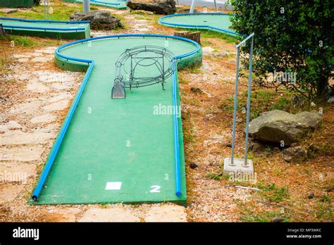 Mini golf course with obstacles, green field Stock Photo - Alamy