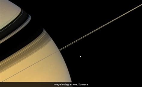 NASA's Cassini Spacecraft Captures Astonishing Pic Of Saturn And Its Moon