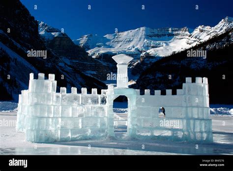 Ice castle on a frozen lake, Lake Louise, Victoria Peak, Banff National Park, Alberta, Canada ...