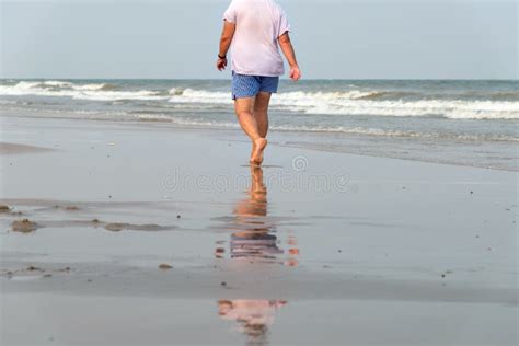 Man Walking Alone on the Beach. Beach Travel at Summer Time Stock Photo ...