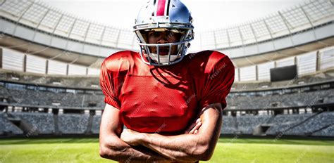 Premium Photo | American football player against rugby goal post on a ...