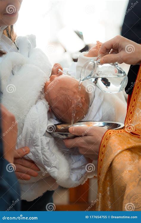 Infant Baptism. Baby Preparing For A Baptismal Ceremony, The Sacrament ...