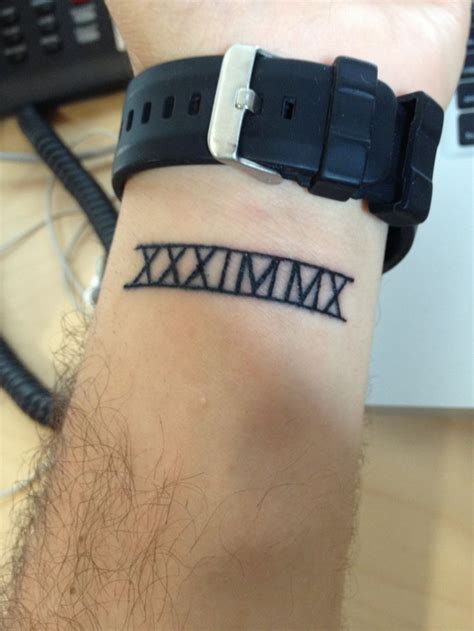 Roman Numeral Wrist Tattoo | Wrist tattoos for guys, Roman numeral wrist tattoo, Wrist tattoos