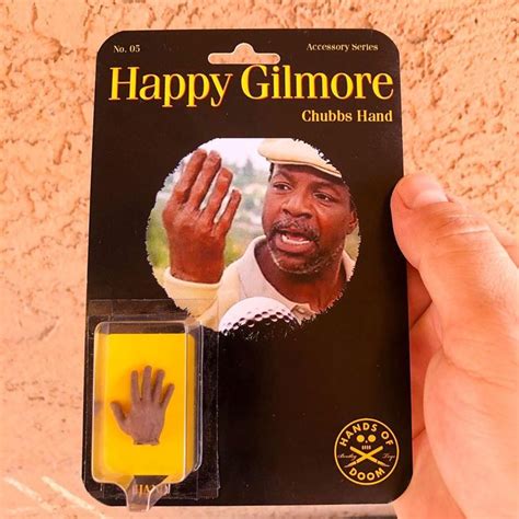 a person holding up a happy gitmore rubber hand