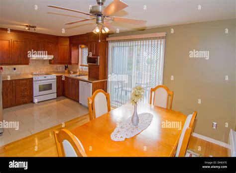 Modern Dining room with kitchen on the background Stock Photo - Alamy