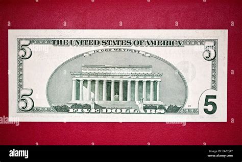 United States five-dollar bill features Lincoln Memorial on the back ...