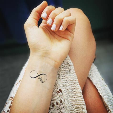 Meaningful word wrist tattoo | Infinity tattoo designs, Wrist tattoos ...