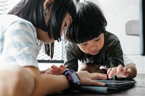 Kids Playing on Their Tablet · Free Stock Photo