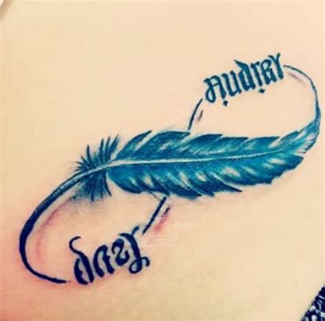 a woman's stomach with a tattoo that reads january and an arrow on it