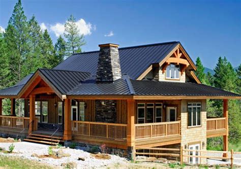 a large wooden house with a metal roof and porches on the side of it