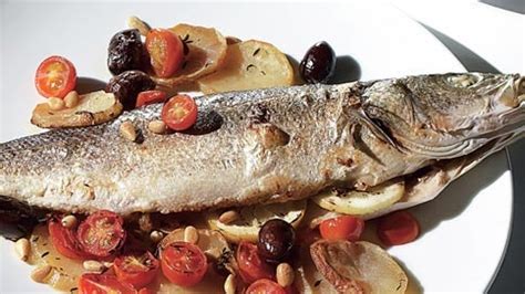 Herb-Roasted Whole Branzino with Potatoes, Tomatoes, and Olives Recipe | Bon Appétit