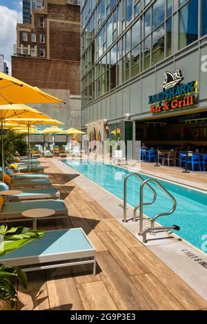 Margaritaville Resort Times Square features a swimming pool at the Landshark Bar and Grill in ...