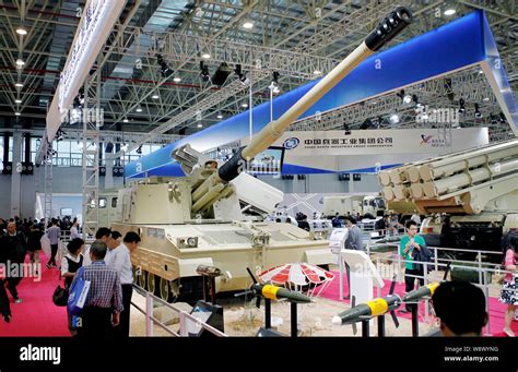 Visitors look at a Chinese-made PLZ52 155mm self-propelled howitzer of China North Industries ...