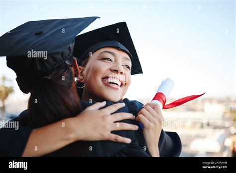 Graduation, education and hug with woman student friends hugging on university campus in ...