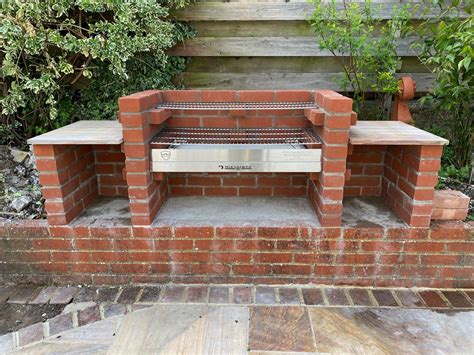 a brick oven sitting on top of a patio