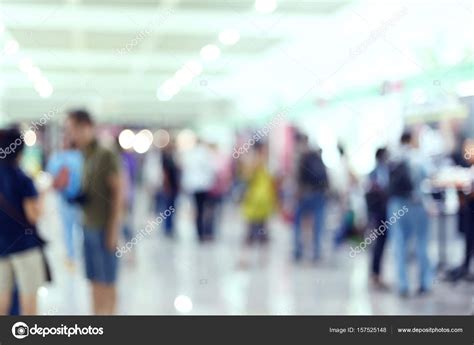 Crowd people traveler in airport terminal, image blur Stock Photo by ©Sutichak 157525148