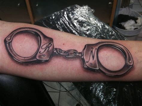 Arm 3d Handcuffs Tattoo by Stay True Tattoo Cuff Tattoo, Art Tattoo ...