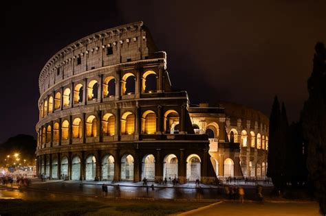 Premium AI Image | The colosseum at night with the lights on